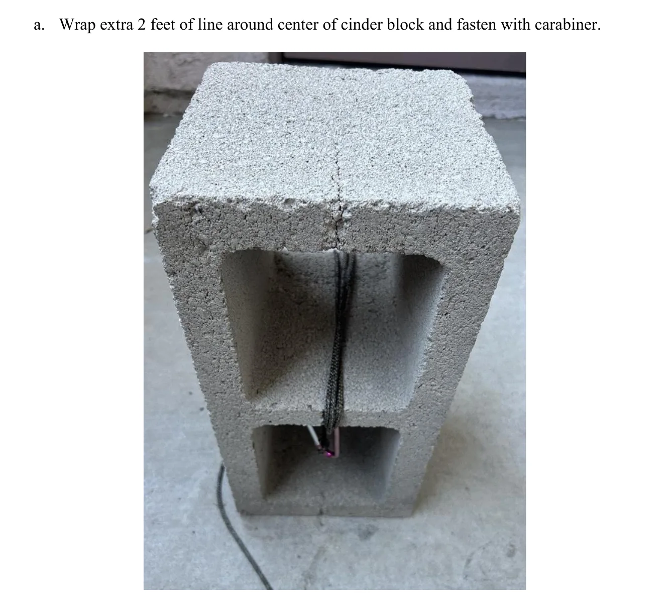 Figure 2.19 Wrap Tether Line. a. Wrap extra 2 feet of line around center of cinder block and fasten with carabiner.